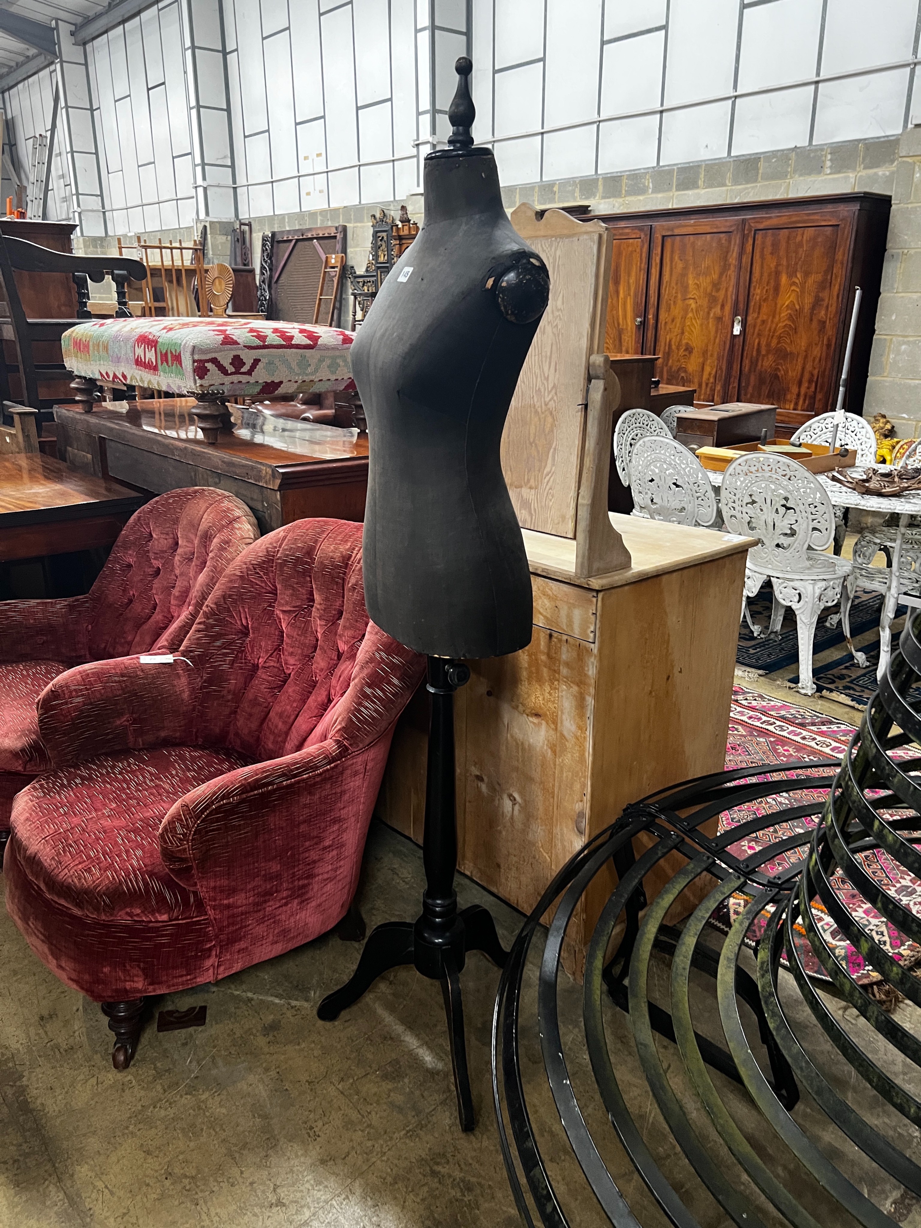 A vintage ebonised telescopic tailor's dummy on tripod stand